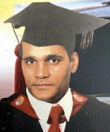 Dr Shiam Chuttoo in academic cap and gown